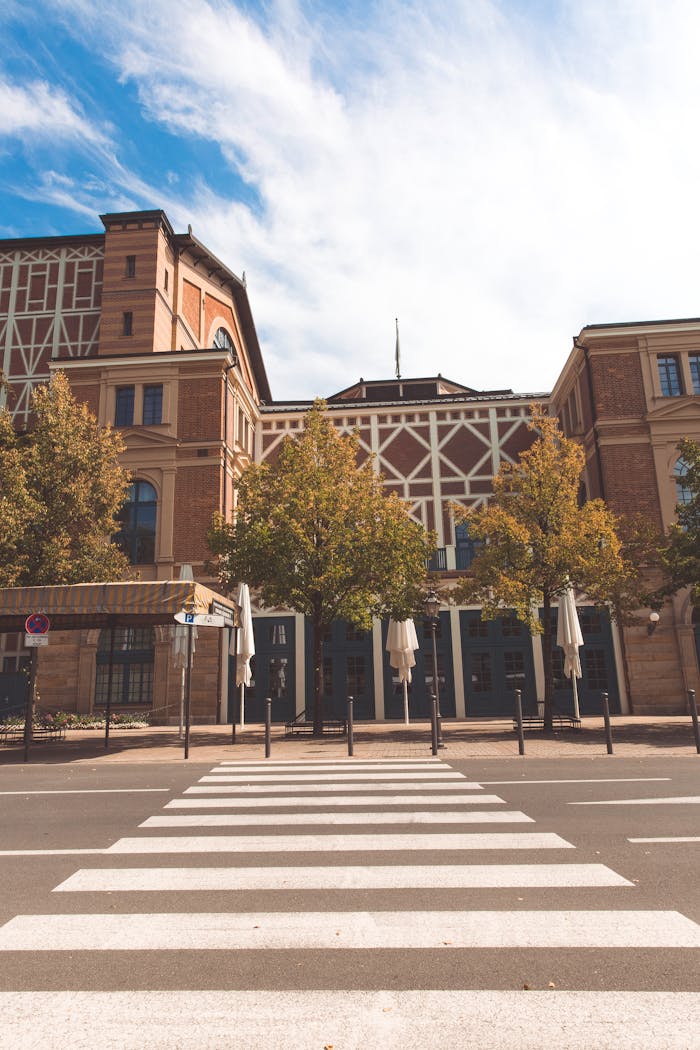 Photograph of a traditional Bavarian building and crosswalk in daylight, showcasing urban architecture.